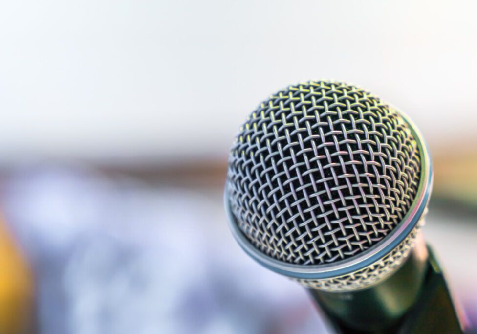 Black microphone in conference room ( Filtered image processed vintage effect. )