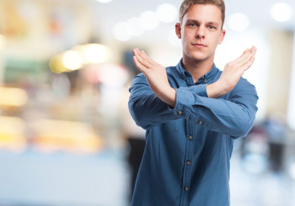 cool young-man cross-gesture
