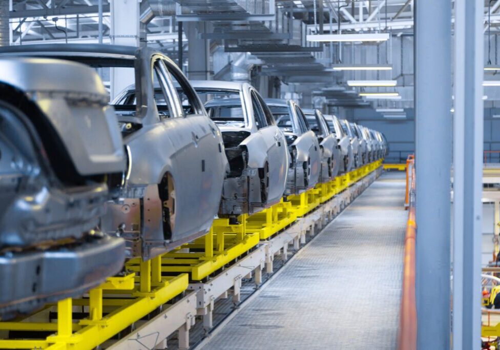 Modern automobile production line, automated production equipment. Shop for the Assembly of new modern cars. The way of Assembly of the car on the Assembly line at the plant